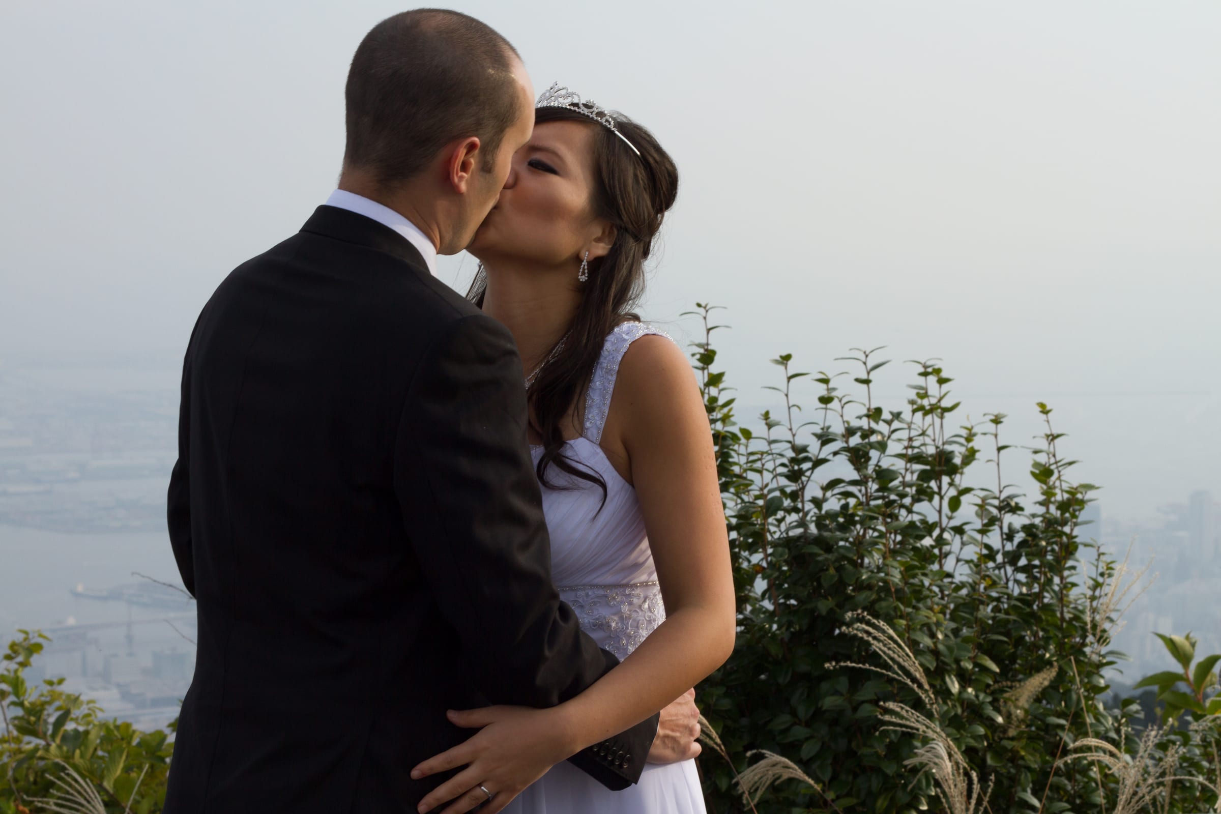 Silhouetted couple embracing outdoors at sunset