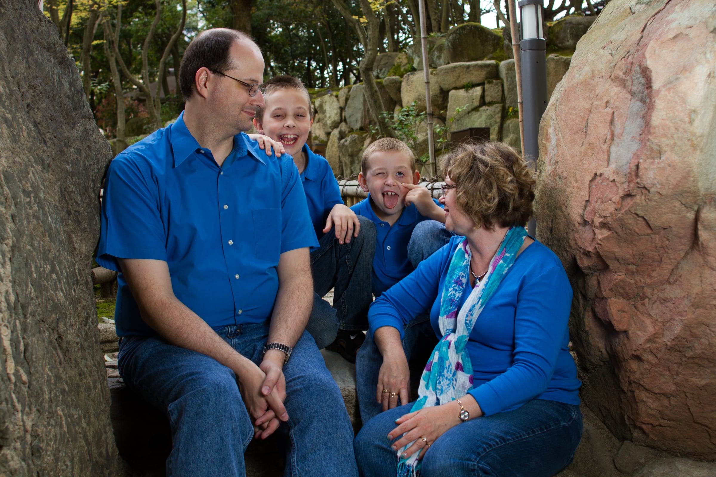 Family interacting together outdoors in natural light